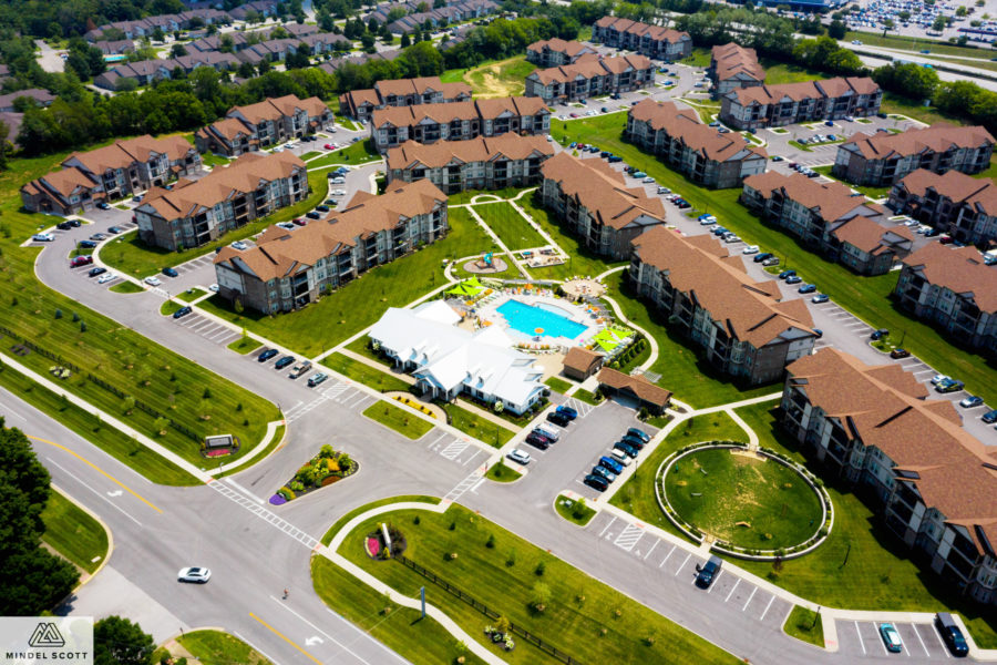 Drone view of Victory Knoll apartment complex with pool